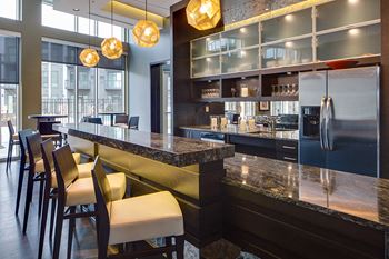 Club room with fully-appointed kitchen, serving island and conversational seating